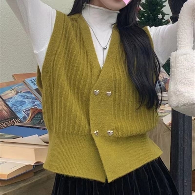 Moteriška megzta be rankovių liemenė su V formos kaklu, dvigubo užsegimo plokštelė, 3D raštas, akrilo-poliesterio mišinys