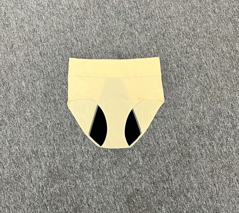 Menstruacijoms skirtos apatiniai su aukštu liemeniu, vientisos spalvos; pagrindinė medžiaga: medvilnės mišinys 95% medvilnė; tarpvagialinė danga 95% medvilnė