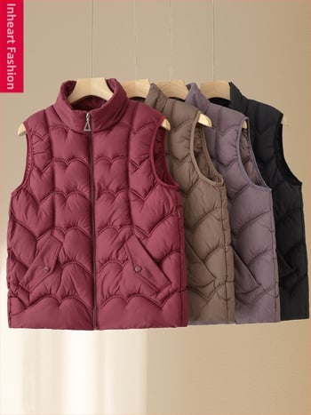 Moteriška žieminė liemenė su pūkų-pam izoliacija, pagrindinis audinys poliester (>95%), ilgis 50–65 cm, be apykaklės, lyginimo nereikalauja, kasdienis elegantiškas stilius