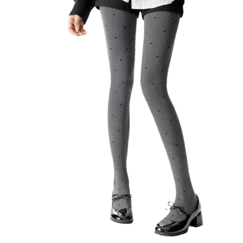 Velúr harisnyanadrág hullám‑pöttyös mintával, közepes vastagság, egyoldali ágyéktáji kivitel, viszkóz 70–80%