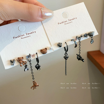 Aino auskarai – lydinys, su cirkoniu, širdies forma, animacinių personažų ir gyvūnų motyvai, tamsus vėjo stilius, moterims, rudens 2025 kolekcija.