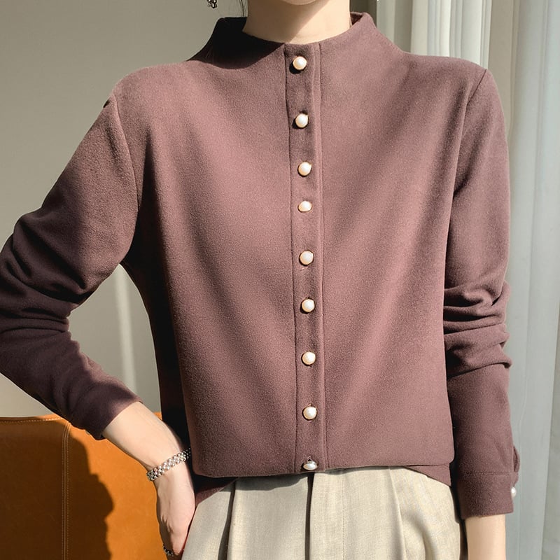 Kreklis kardigāns no ķīmisko šķiedru maisījuma ar poliesteru, vienkrāsains, stāvošā apkakle, garas piedurknes, pūderēta virsma, pērlīšu pogas, izsmalcināts ikdienas stils, garums 50–65 cm