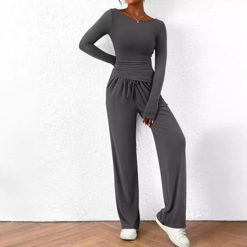 Kasdienis dviejų dalių kostiumas: asimetrinis viršus su ilgomis rankovėmis ir platėjančios kelnės iš poliesterio