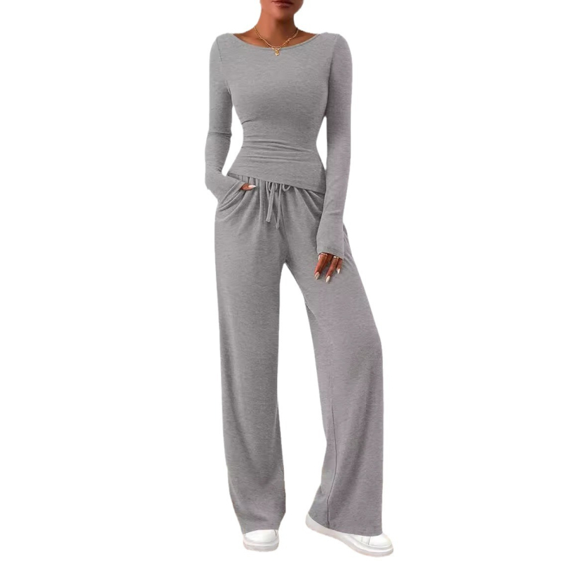 Kasdienis dviejų dalių kostiumas: asimetrinis viršus su ilgomis rankovėmis ir platėjančios kelnės iš poliesterio