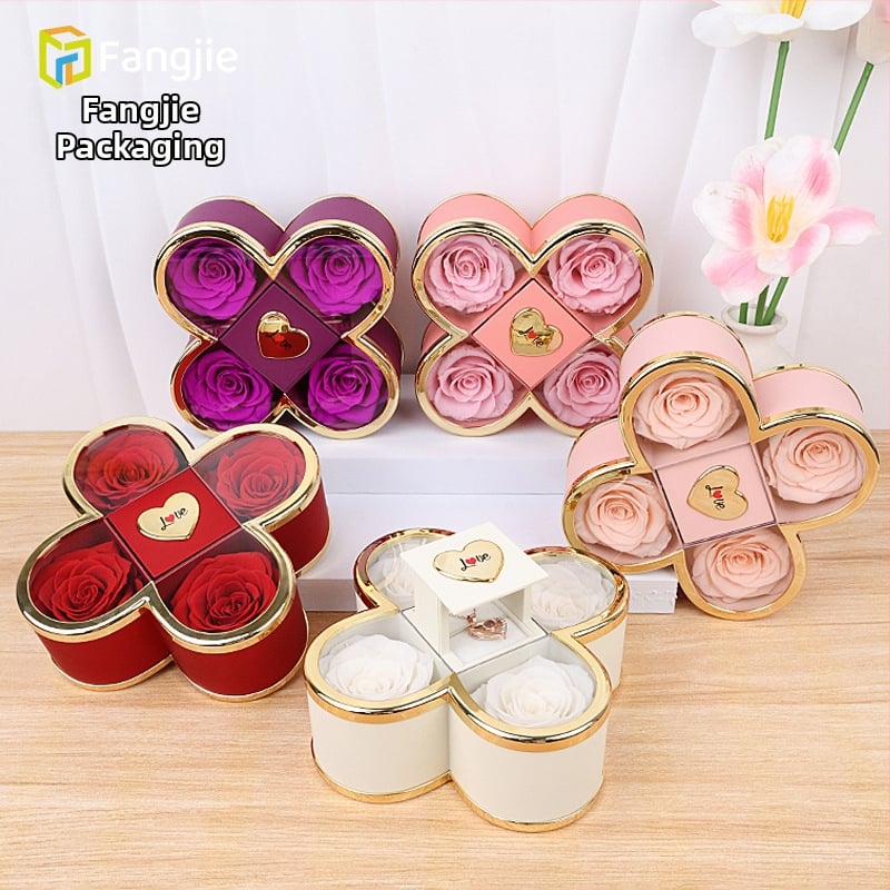 Kaklarotas dāvanu kastīte ar slēgtu četru lapu rozes mehānismu, plastmasas korpuss, kartona iepakojums, iekļauj dāvanu kastīti ar ziediem un somu