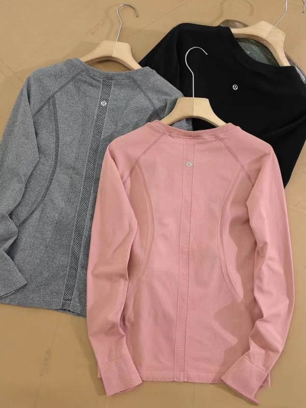 Varrásmentes, hosszú ujjú női jóga felső – csípőig érő hossz, testhez álló szabás, nylon anyag, elasztikusság