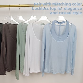 Naiste hingav pikkade varrukatega jooga-top, laia lõikega ja U-kaelusega, veidi läbipaistev, nailonist väline kangas, vooder 80% polüester / 20% viskoos.