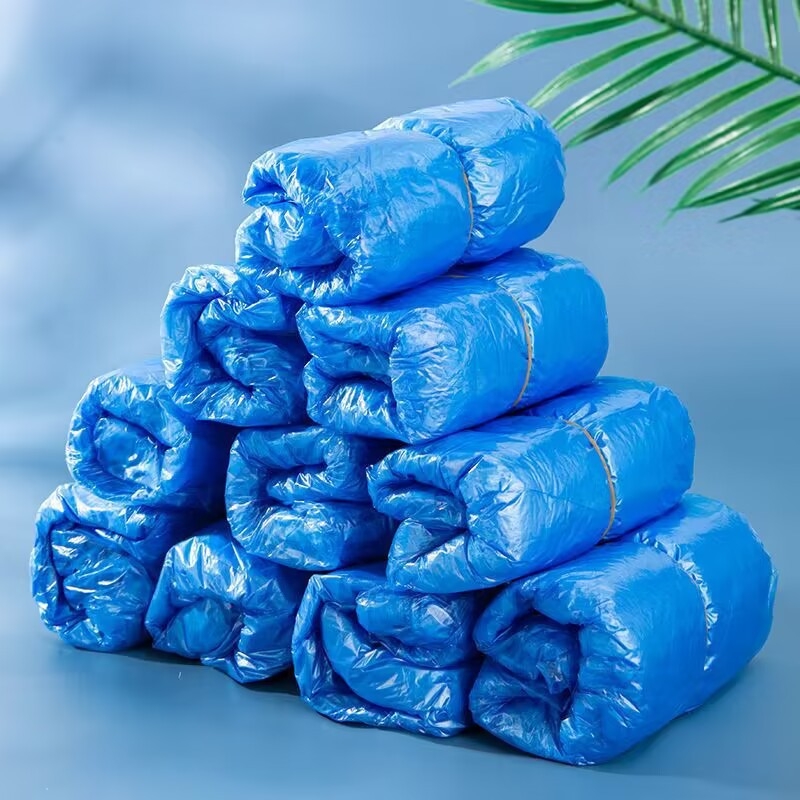 Καλύμματα παπουτσιών μίας χρήσης από PE για εσωτερική χρήση – προστασία από σκόνη και αδιαβροϊκότητα, πάχος 0,03 mm, συσκευασία 100 τεμάχια