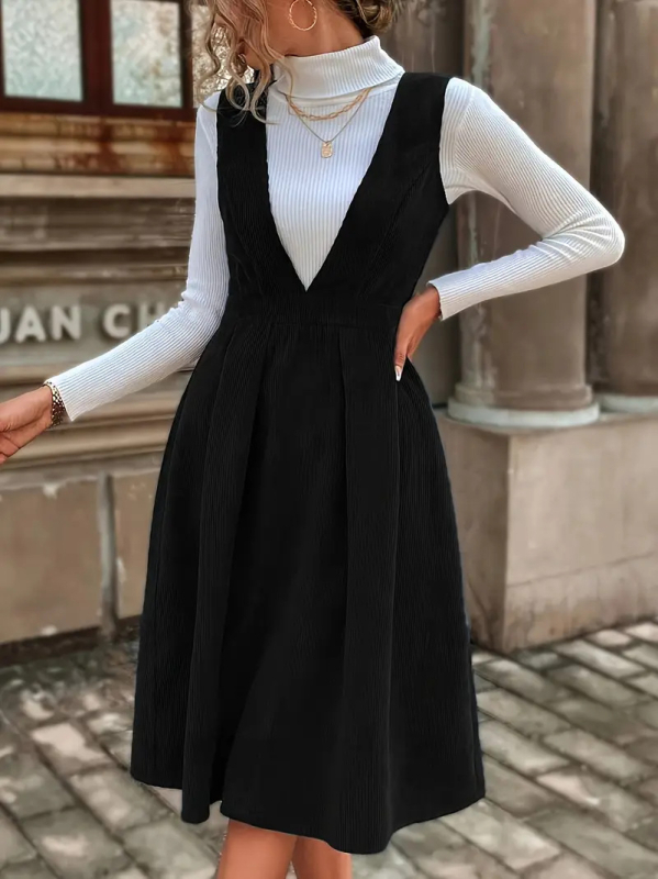 Poliészter anyagú közép hosszúságú ruha, magas derékkal és V-nyakú kivágással