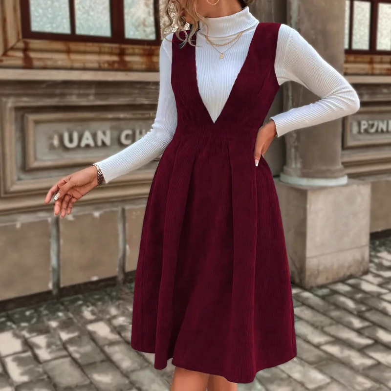 Poliészter anyagú közép hosszúságú ruha, magas derékkal és V-nyakú kivágással