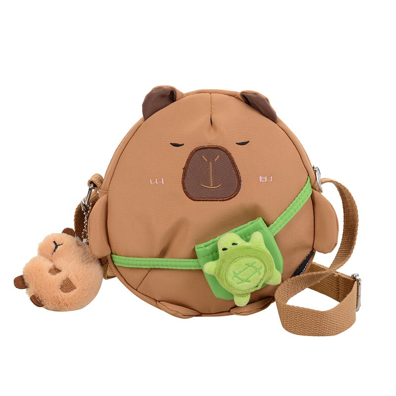 Capybara crossbody torba, najlon vanjski dio, poliester podstava, okrugli oblik, zatvarač, džep za telefon, jedna naramenica