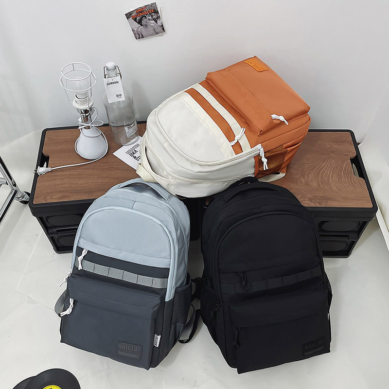 Unisex školski ruksak, street style, kapacitet 20–35L, najlon materijal, uzorak u usklađenim bojama, otpornost na habanje i smanjenje opterećenja