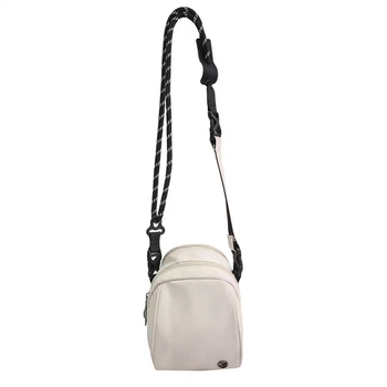 Crossbody mini torba – lagana, s više pretinaca, preko ramena; poliester, podstava najlon; ženska svakodnevna torba