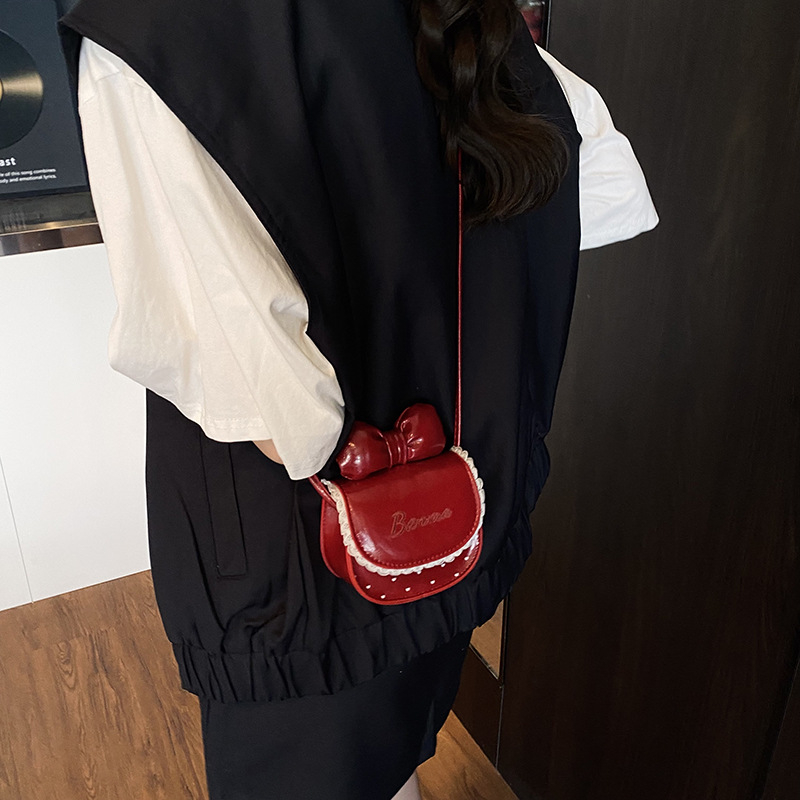 Dječja crossbody torba od PU materijala, uzor mašnica, podstava od poliestera, prozračna