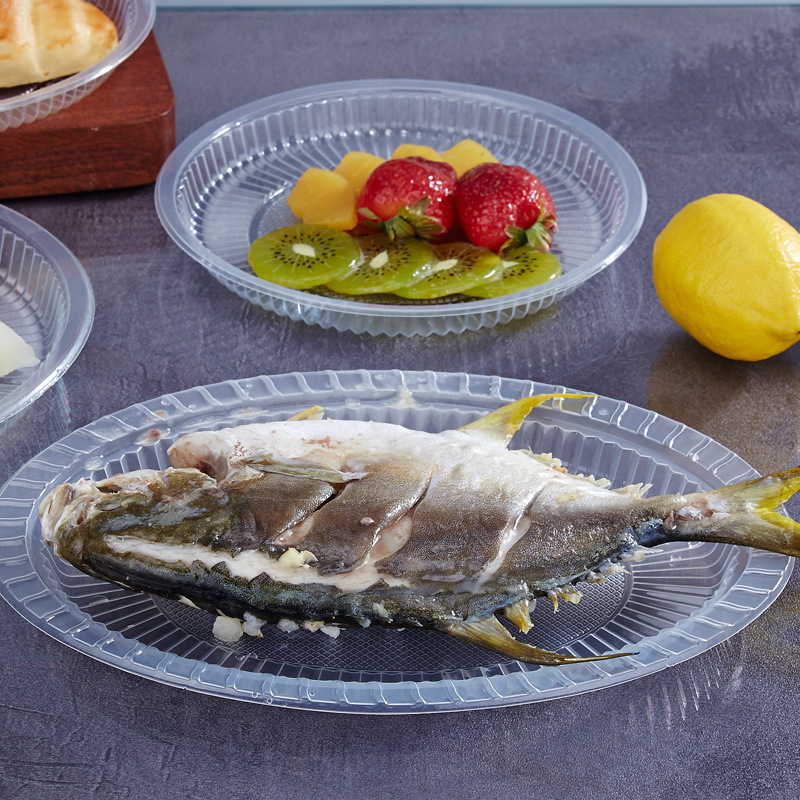 Farfurie de unică folosință din plastic, rezistentă la temperaturi înalte, transparentă, rotundă, cu model uniform.