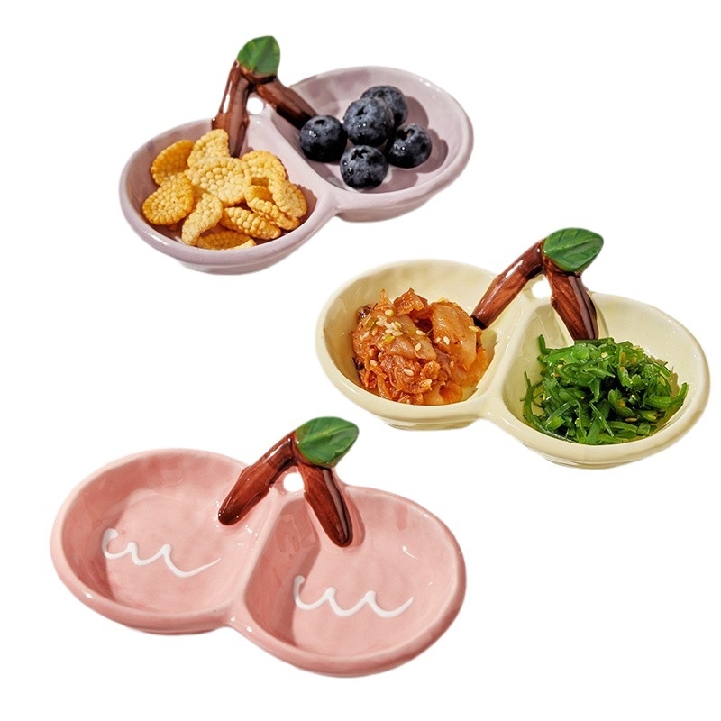 Kerámiából készült kétrekeszes mártásos tál, szabálytalan formájú, szószokhoz és teás nassolnivalókhoz; mikrohullámú sütőben nem használható.