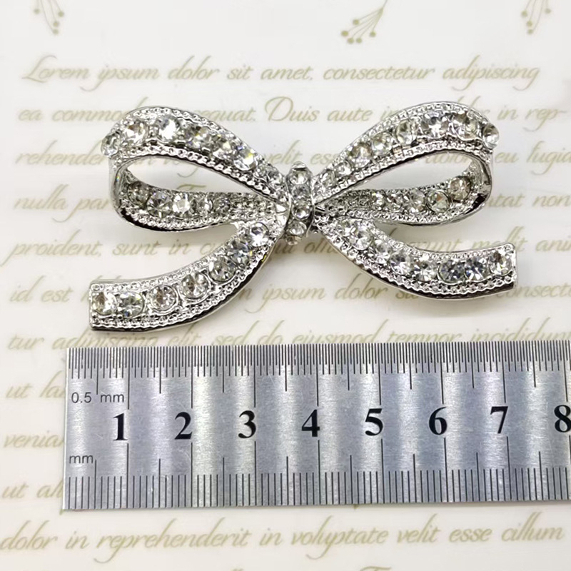 Μπρόζ από κράμα με γεωμετρικό σχέδιο σε σχήμα φιόγκο, διακοσμητική και σταθερή καρφίτσα για γυναικείες ενδυμασίες και τσάντες, Άνοιξη 2024