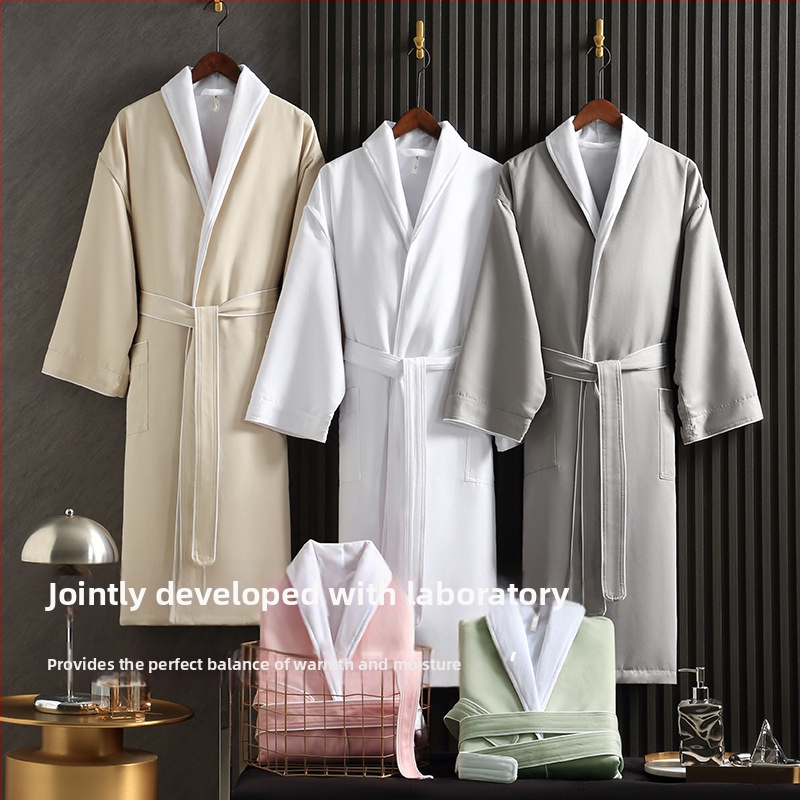 Халат за баня със хотелски стил, абсорбиращ вода, дебел двуслоен, унисекс за есенно-зимно ползване; Материал: Ултрафайн влакна; Тегло: 1150 g; Прежда: единична нишка; Тъкан: Plain weave; Персонализиране по заявка; Лого печат възможен