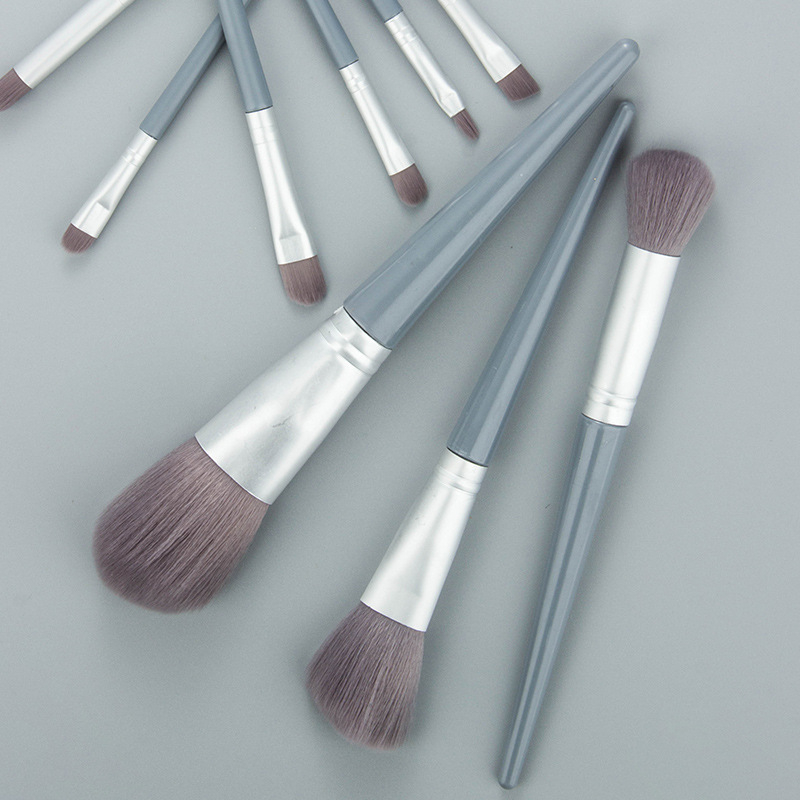 Set de 9 pensule de machiaj, cu peri sintetice, mânere lungi din plastic și husă din plasă