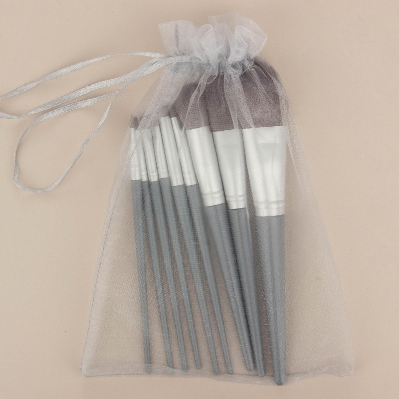 Set de 9 pensule de machiaj, cu peri sintetice, mânere lungi din plastic și husă din plasă