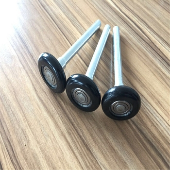 Rulon din nailon pentru uși glisante cu ax de 11 mm, rază a canelurii frânghiei 6 mm, grosime perete 12 mm, sarcină maximă 25 kg