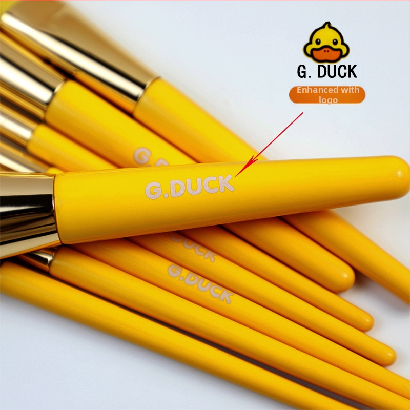 12 darabos kacsás témájú sminkecset-készlet, műszálas sörtékkel, fa fogókkal, teljes hossz 18 cm, sörtéj hossza 5 cm, PVC dobozban