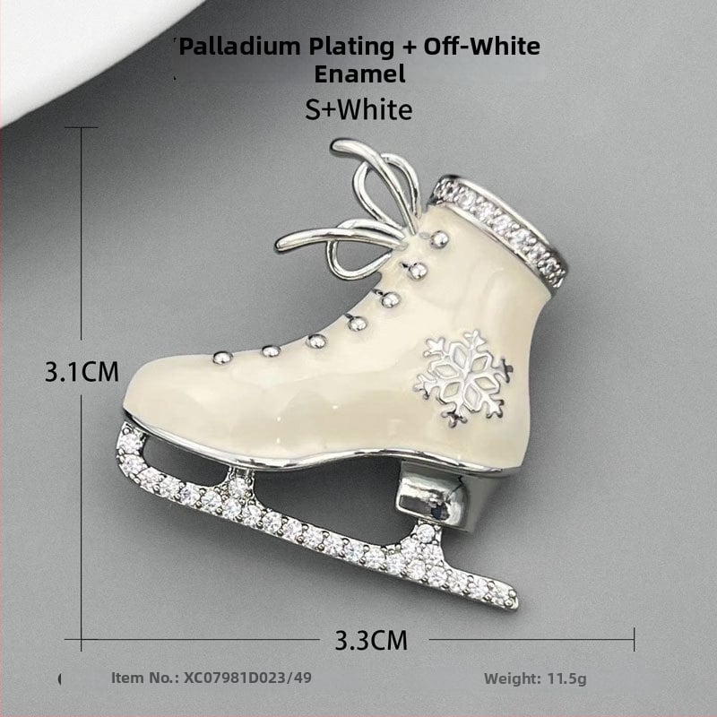 Kitűző, réz alapú, jégpálya forma, zománcfelület, olajcsepp technika, könnyed luxus stílus.