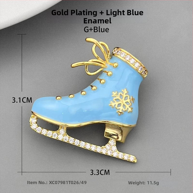 Kitűző, réz alapú, jégpálya forma, zománcfelület, olajcsepp technika, könnyed luxus stílus.