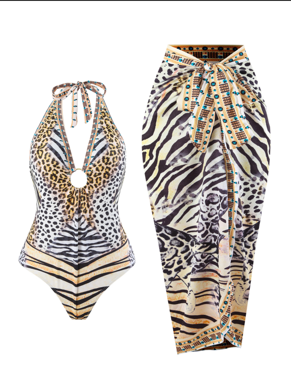 Leopárd mintás egyrészes fürdőruha, fűzős nyakú halterrel, hasat takarja géz szoknyával, hát nélküli