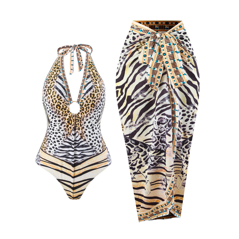 Leopárd mintás egyrészes fürdőruha, fűzős nyakú halterrel, hasat takarja géz szoknyával, hát nélküli