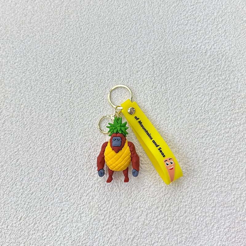 Breloc din PVC cu o figurină din lemn în formă de omuleț, purtând pantofi, și un pandantiv rechin