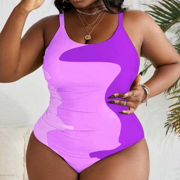 Jednodijelni kupaći kostim s printsom, otvorena leđa, visoka elastičnost i jastučić za prsa.