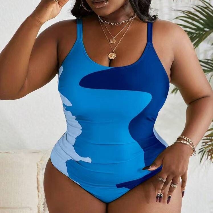 Jednodijelni kupaći kostim s printsom, otvorena leđa, visoka elastičnost i jastučić za prsa.