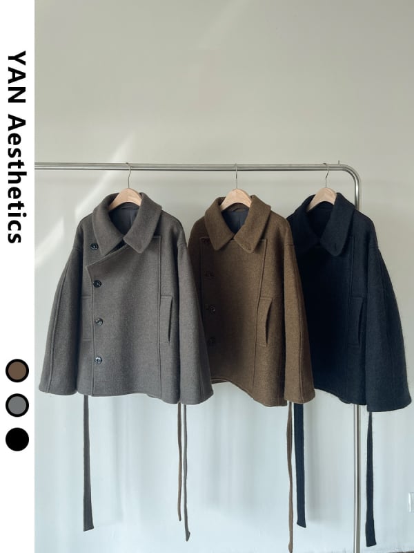 Ženski vuneni kaput s alpaka smjesom (50–70%), jednobojni tweed, slobodan kroj, rever ovratnik, tri gumba u dva reda