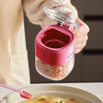 Recipient din sticlă pentru condimente, cu capac basculant și linguriță, pentru condimente solide.