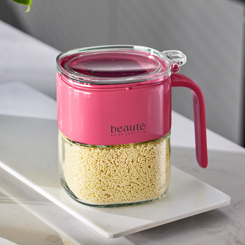 Recipient din sticlă pentru condimente, cu capac basculant și linguriță, pentru condimente solide.