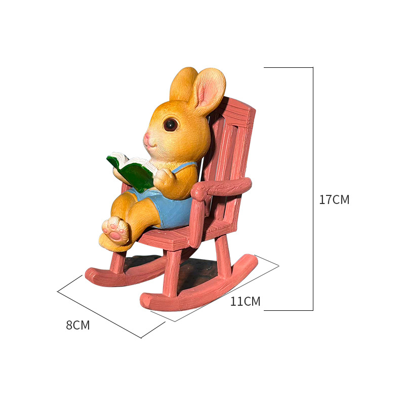 Olvasó nyúl hintázó székkel – kültéri dekoráció kertbe és erkélyre, cartoon stílusú, szintetikus gyantából készült