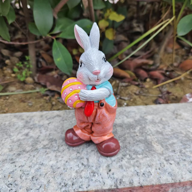Húsvéti nyúl szobor, rajzfilmszerű stílus, szintetikus gyanta, karton csomagolás, Xingmao márka