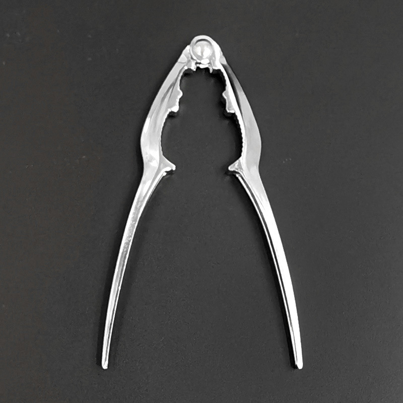 Klešta za orahe – višenamjenski otvarač ljuske, moderan minimalistički dizajn (Brend Naughty; Podrijetlo Yiwu; Izdan u ljeto 2017)