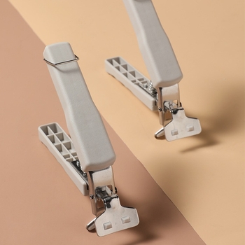 KOMEKI Višestruki klips protiv opeklina za vruće ploče; materijali: plastika, nehrđajući čelik, željezo