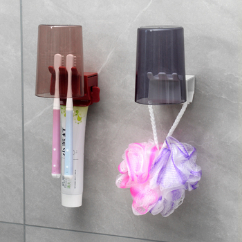 Držač četkica za zube s ugrađenim stlačivačem paste, plastični, za zid