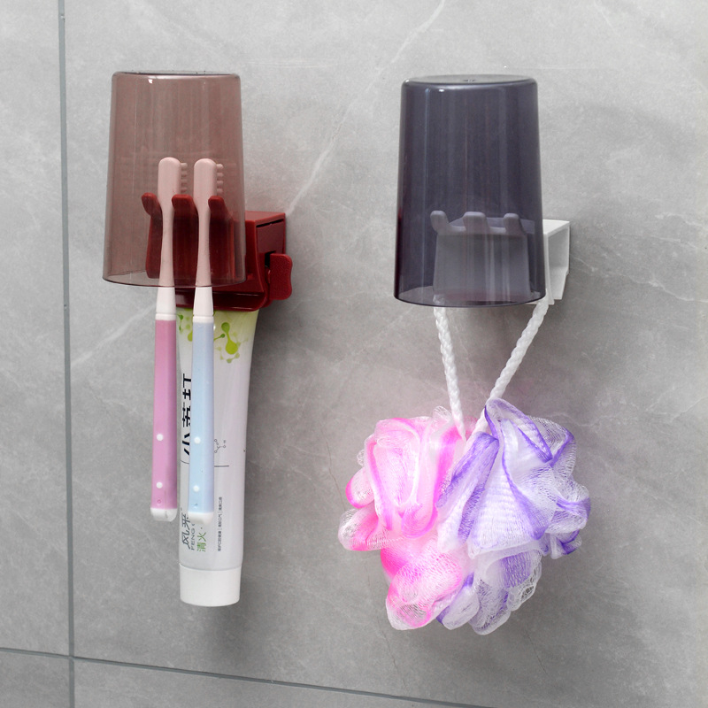 Držač četkica za zube s ugrađenim stlačivačem paste, plastični, za zid