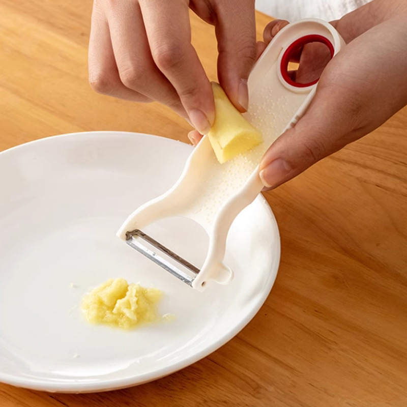 Desfăcător/curățător multifuncțional pentru fructe și legume — lamă din oțel inoxidabil, corp din polistiren, origine Japonia, lansare în 2023