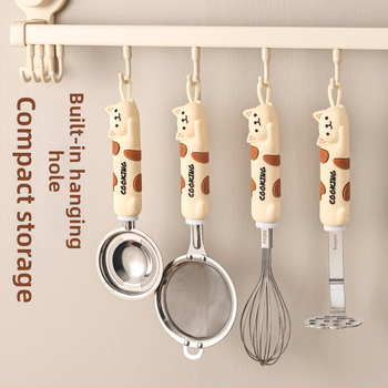 Nerezová kuchynská súprava s mačkou v kreslenej podobe: šľahač na vajcia, separátor bielkovín, sito na múku a pasírovač zemiakov