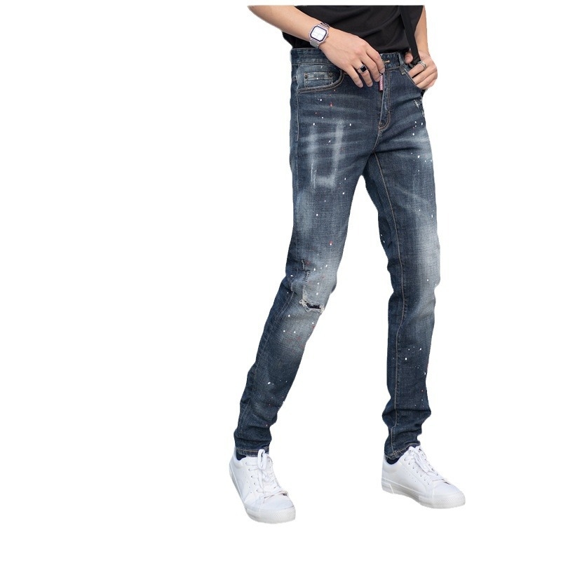 Muške traperice od denima s istrošenim uzorcima i kapljicama boje, slim fit, srednji pojas, uski završetak nogavica