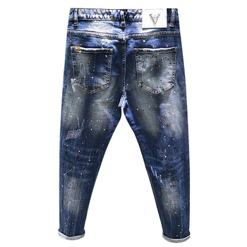 Traperice s kontrastnim kapljicama boje, pamuk-elastanski denim, slim-fit, srednji pojas, zatvarač na zip