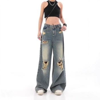 Traperice visokim strukom, poderane detalje, ravno slobodan kroj s širokim nogama, pamuk denim