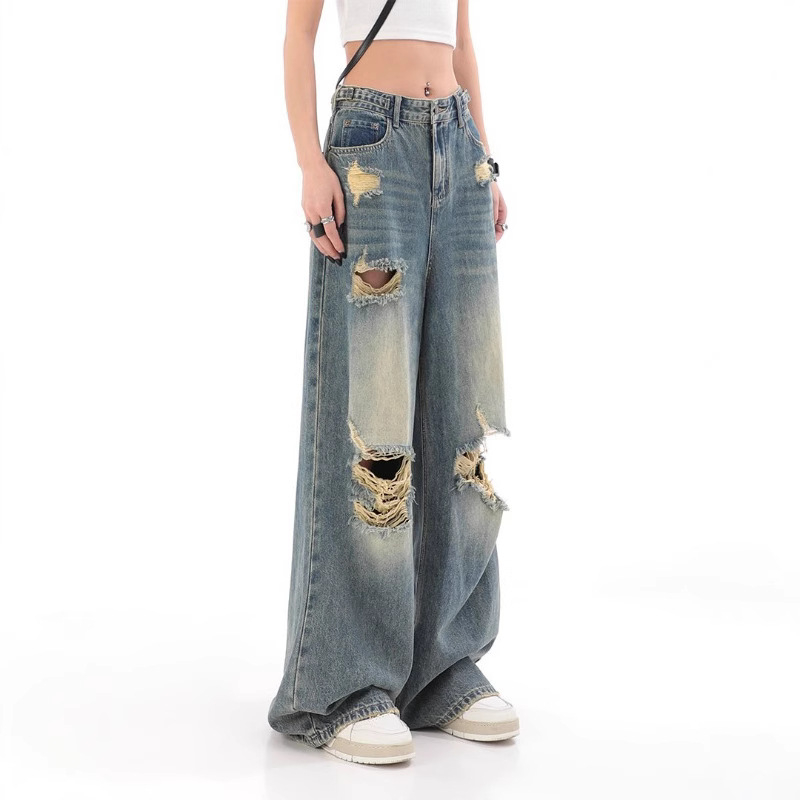 Traperice visokim strukom, poderane detalje, ravno slobodan kroj s širokim nogama, pamuk denim