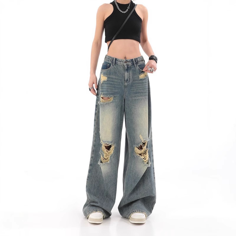 Traperice visokim strukom, poderane detalje, ravno slobodan kroj s širokim nogama, pamuk denim