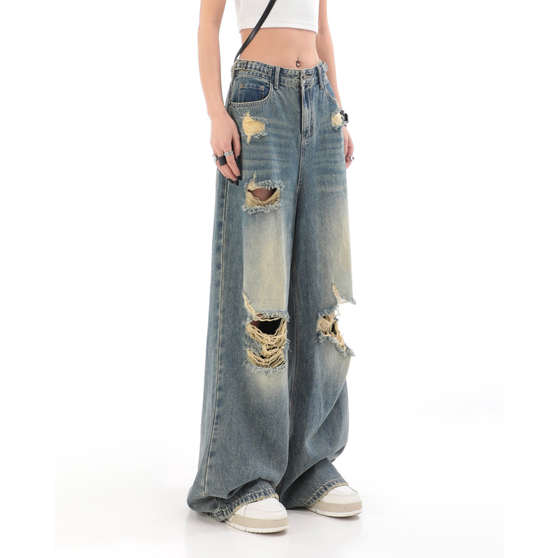 Traperice visokim strukom, poderane detalje, ravno slobodan kroj s širokim nogama, pamuk denim